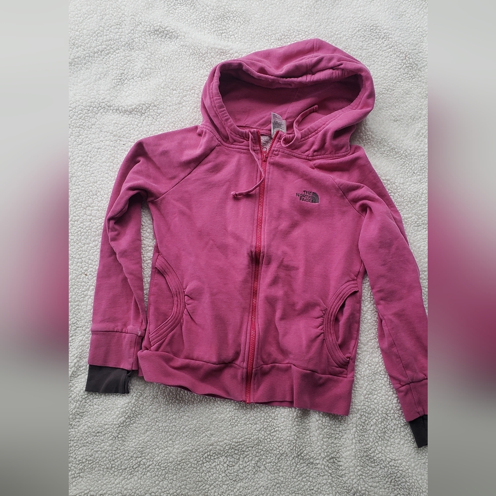 The north face full zip pink hoodie size medium has some wear see photo northfa